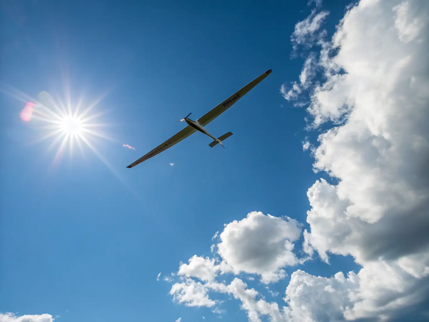 An action shot of gliders participating in a competitive gliding event, showcasing the precision and skill involved in competitive gliding, set against the scenic backdrop of the French countryside.